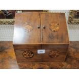 A VICTORIAN MAHOGANY AND MARQUETRY INLAID STATIONARY BOX the slope front doors with circular