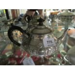 A SILVER TEA POT WITH EBONISED HANDLE together with a milk jug and sugar bowl (3)