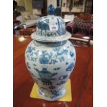 A ORIENTAL STYLE BLUE AND WHITE BALUSTER SHAPED JAR AND COVER dome shaped lid with raised finial