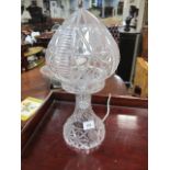 A CUT GLASS TABLE LAMP with mushroom shade raised on spreading base 40cm high