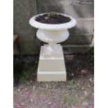 A PAIR OF VICTORIAN STYLE CREAM PAINTED CAST IRON COMPANA SHAPED JARDINIERES the gadrooned rim