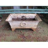 A CAST IRON WHITE PAINTED RECTANGULAR PLANTER in Georgian style with splayed supports