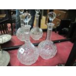 A PAIR OF CUT GLASS DECANTERS each of bulbous form with stoppers