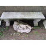 A WHITE PAINTED STONE GARDEN BENCH of rectangular form raised on scrolled shaped side supports 49cm