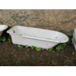 A WHITE ENAMELLED CAST IRON BATH with rounded rim and chrome waste fitting 64cm x 196cm x 82cm