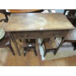 A 19TH CENTURY MAHOGANY OCCASIONAL TABLE a rectangular top with moulded rim above a single frieze