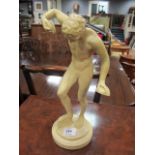 A COMPOSITION MODEL of a classical sports man shown on a circular pedestal 38cm high