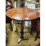 A 19TH CENTURY MAHOGANY OCCASIONAL TABLE circular top with moulded rim raised on ring turn table