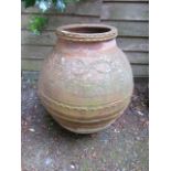 A TERRACOTTA GARDEN URN OF CIRCULAR TAPERING FORM