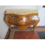 A CONTINENTAL BOMBE SHAPED CHEST OF DRAWERS the yellow mottled marble top with moulded rim above