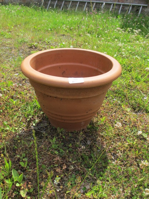 A MISCELLANEOUS COLLECTION OF TERRACOTTA AND ENAMELED PLANTERS including three wall mounted demi -