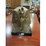 A GILT PLASTER MODEL OF A SPHINX on a black plinth base 37cm x 28cm x 18cm