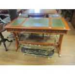 A REGENCY STYLE MAHOGANY LIBRARY TABLE the green leather tooled top with moulded rim above three