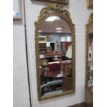 A PAIR OF GEORGIAN STYLE GILDED PIERVIEW MIRRORS of arched form the foliate frames headed by a