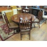 A VICTORIAN ROSEWOOD POD TABLE the circular moulded top above an octagonal column on platform base