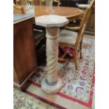 A PAIR OF VEINED MARBLE PLINTHS the circular tops raised on fluted column supports with metal ends