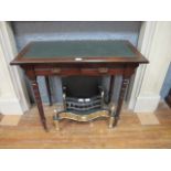 AN EDWARDIAN MAHOGANY AND LEATHER TOOLED WRITING TABLE the rectangular top with green leather