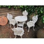 A FIVE PIECE VICTORIAN STYLE WHITE PAINTED GARDEN SUITE COMPRISING OF A CIRCULAR TABLE WITH FULLY