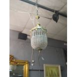 A CONTINENTAL STYLE GILT BRASS BASKET CHANDELIER the laurel leaf frame hung with foliate swags