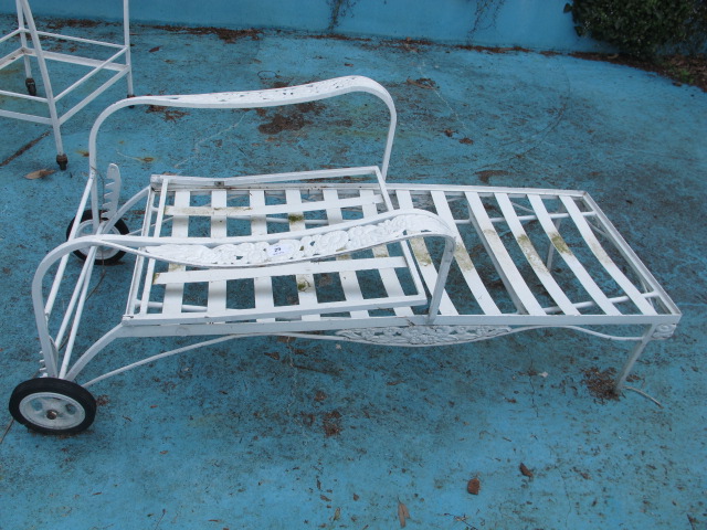 A WHITE PAINTED WROUGHT IRON GARDEN RECLINER of rectangular form with adjustable back shaped open