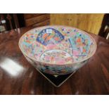 AN ORIENTAL STYLE PAINTED PORCELAIN FRUIT BOWL of circular form decorated with foliate motif and