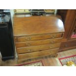 A GEORGIAN MAHOGANY BUREAU the rectangular top above the fall front opening to reveal a green baize