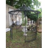 A LARGE ORIENTAL STYLE WROUGHT IRON MARQUEE the open pagoda shaped top headed by an acorn finial