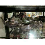 A THREE PIECE SILVER PLATED TEA POT comprising tea pot sugar bowl and jug