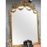 A VICTORIAN STYLE GILT OVERMANTEL MIRROR of large proportions,