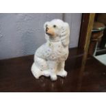 A PAIR OF STAFFORDSHIRE STYLE SEATED DOGS 26cm