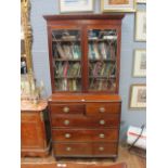 A GEORGIAN MAHOGANY LIBRARY BOOKCASE the roped cornice above a pair of astragal glazed doors with