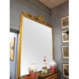 A VERY FINE CONTINENTAL GILTWOOD AND GESSO MIRROR the rectangular plate within a moulded frame with