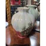 A PAIR OF KENSINGTON CHINA LUSTRE VASES each of baluster form decorated with floral heads and