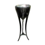 AN EBONISED JARDINIERE STAND with tin liner and three out swept legs