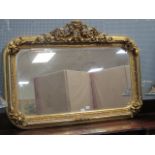 A FRENCH STYLE GILT RECTANGULAR MIRROR with ornate surround and Cupid surmount 100cm x 141cm