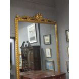 A VERY FINE CONTINENTAL GILTWOOD AND GESSO MIRROR the rectangular plate within a moulded frame with