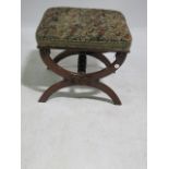 A GEORGIAN STYLE MAHOGANY FRAMED FOOT STOOL the rectangular tapestry style top raised on shaped