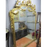 A VICTORIAN STYLE GILT OVERMANTEL MIRROR of large proportions,