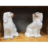 A PAIR OF STAFFORDSHIRE STYLE SEATED DOGS 26cm