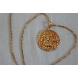 18K gold pendant with ancient figures and animal decoration on an 18ct gold box chain. 18g