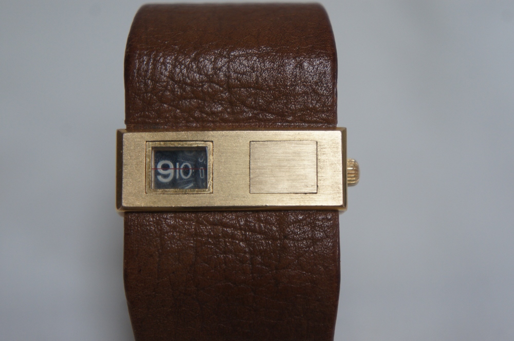 Gold plated LIP digital display winding wristwatch with original tan leather strap, marked PL OR