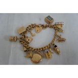 9ct gold charm bracelet with fifteen charms and padlock