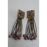 Pair of Miriam Haskell style gold plated filigree ear clips with purple glass beads, length 80mm