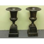 Pair of cast-iron campana garden urns on pedestals. Ht. 30 ins.
