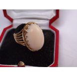 Oval pale pink coral ring set in gold, size N