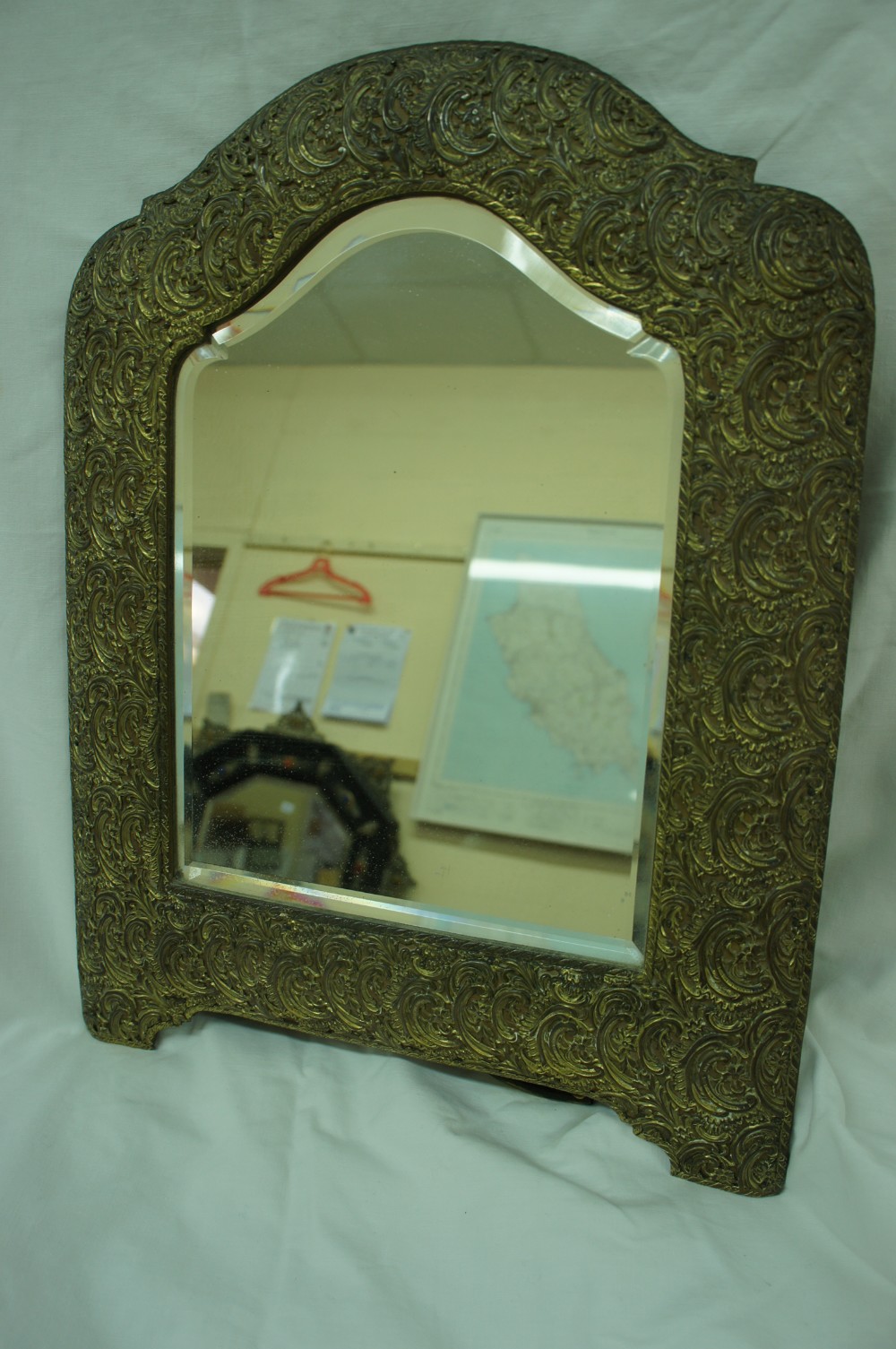 Edwardian gilt brass arched top dressing table mirror with C scroll decoration to border and stand