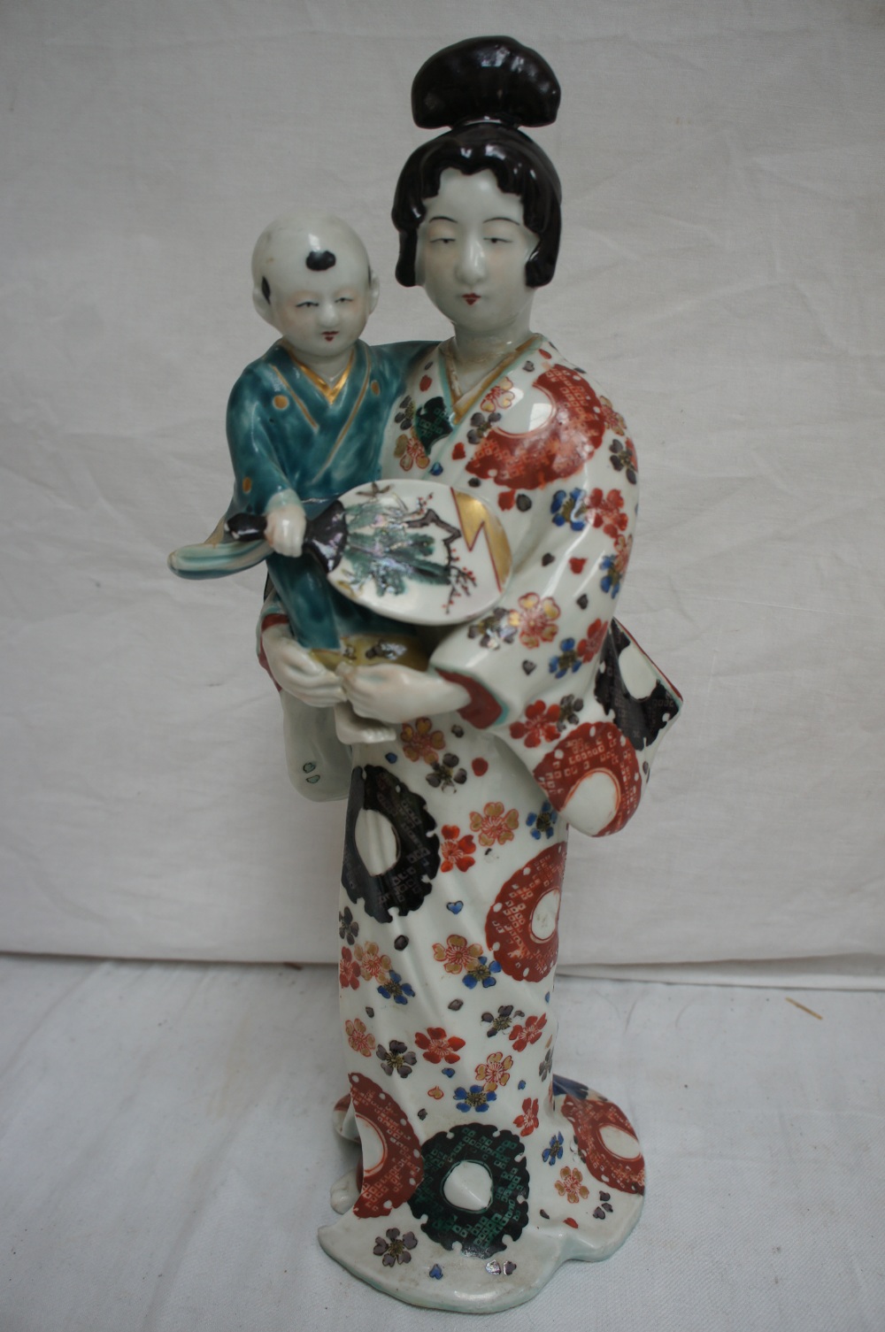 Japanese pocelain figure of mother and child. Ht. 14.25 ins.