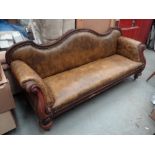 Victorian carved mahogany three seater settee, shaped back, scroll arms and turned legs on castors