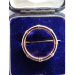 15ct gold circular bamboo brooch, 2.5 g