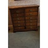 Late Victorian oak twelve-drawer collector's chest with brass handles on splayed bracket feet